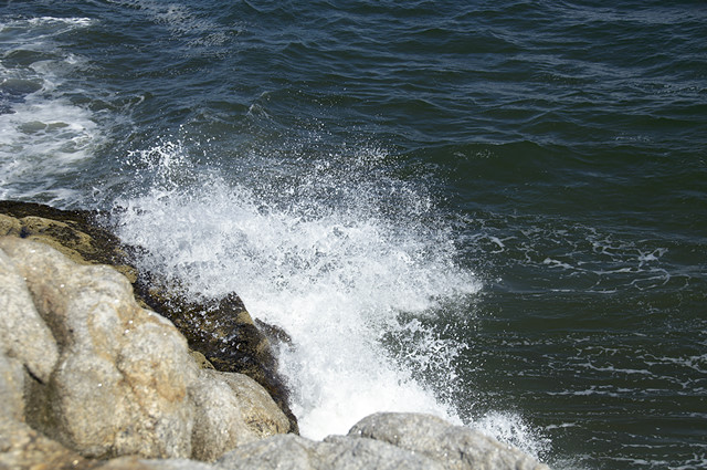 surf crashing on rocks